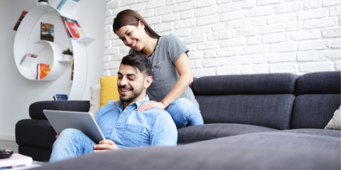 Young couple in living room relaxing