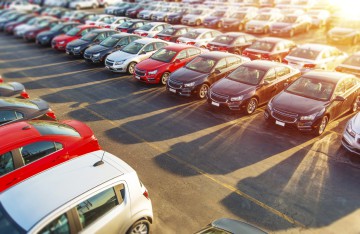 Dealer New Cars Stock. Colorful Brand New Compact Vehicles For Sale Awaiting on the Dealer Parking Lot. Car Market Business Concept.