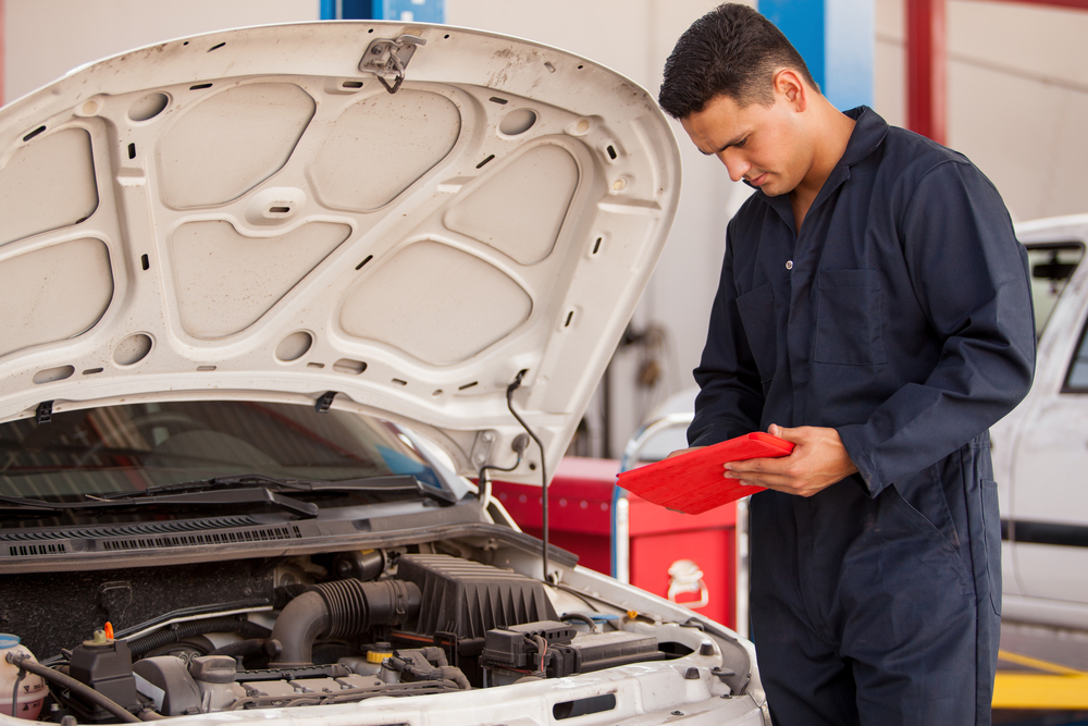 mechanic giving maintenance to a car in texas