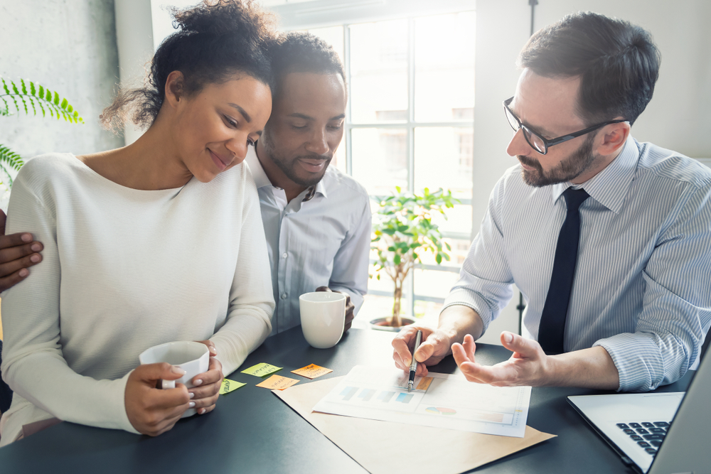 couple talking with life insurance agent