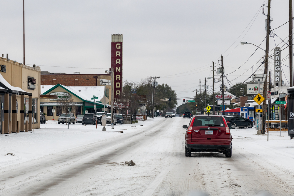 car driving down winter road in dallas texas