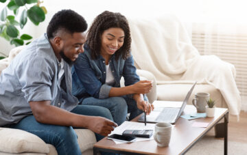 african american couple going over budget