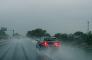 car driving in heavy rain