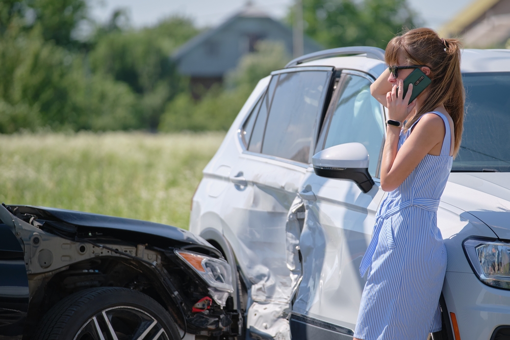 woman on phone after car accident