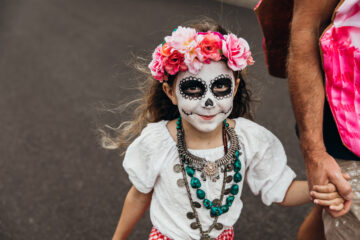 Young girl dresses up for Dia de los Muertas