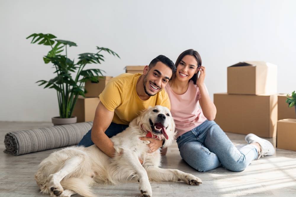 couple with dog in new apartment