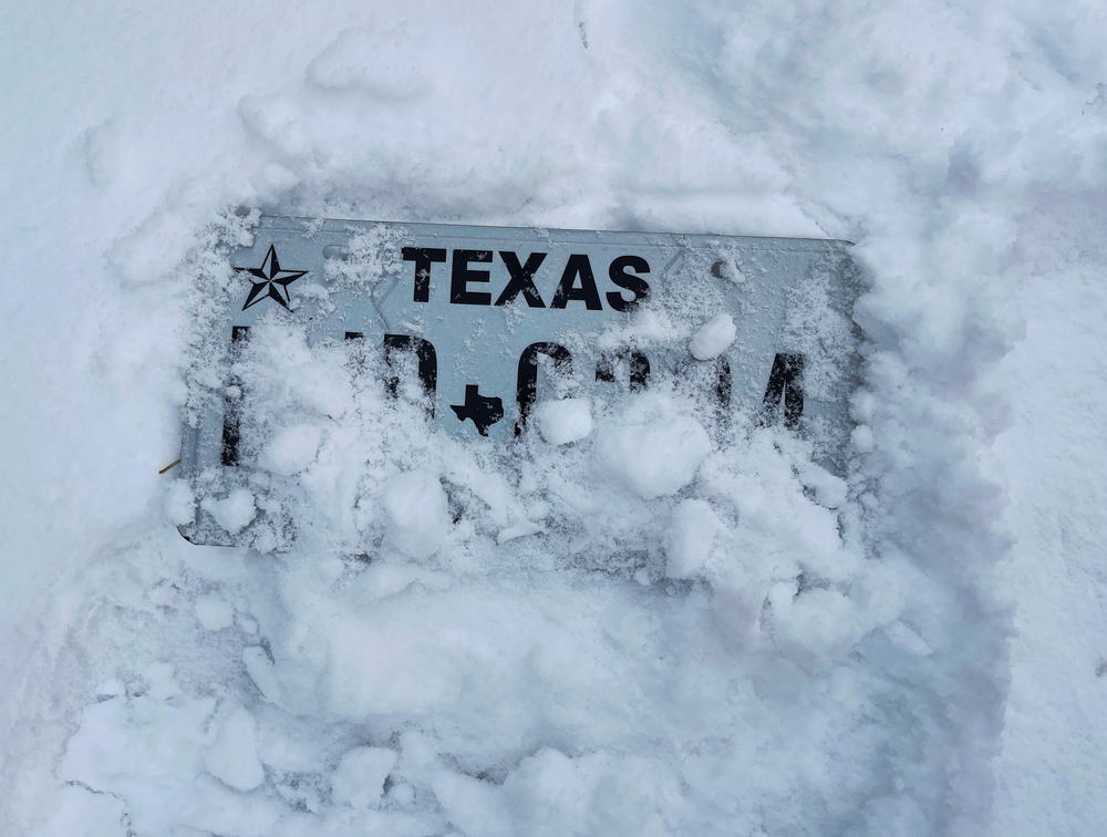 texas license plate buried in snow