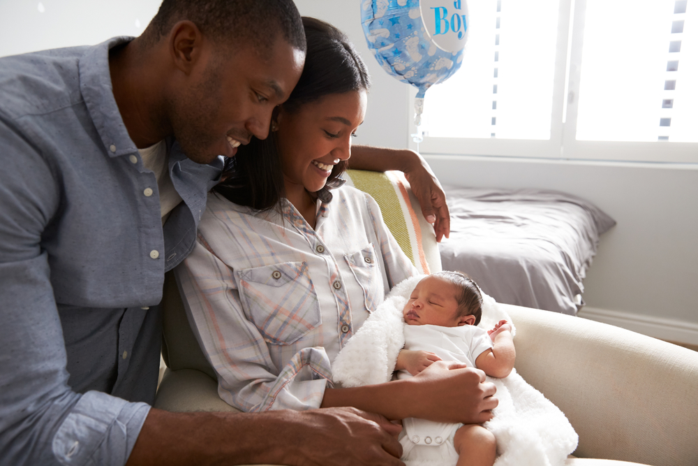 young family with new baby in hospital