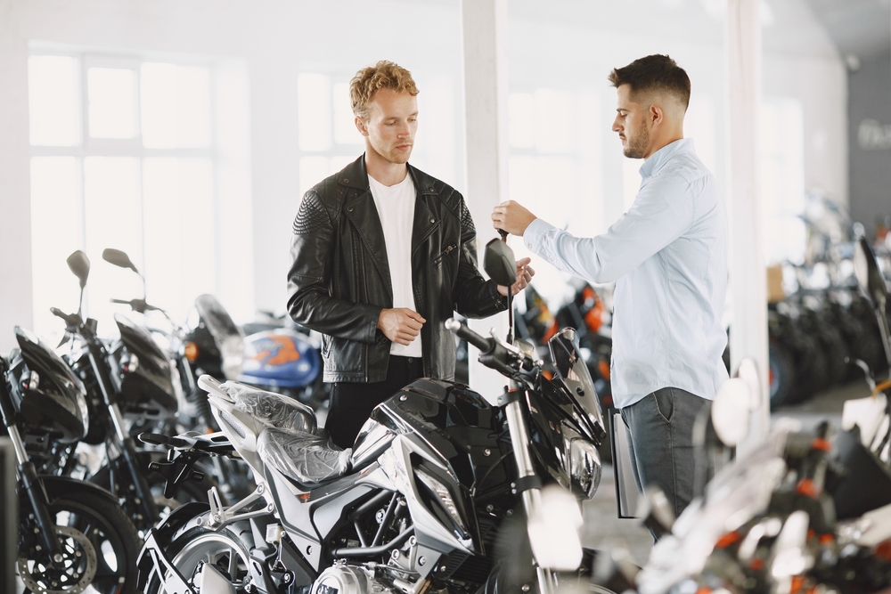 man purchasing motorcycle