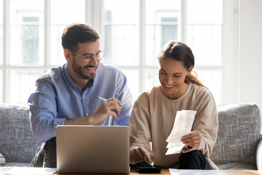 Couple reviews their renters insurance in their apartment