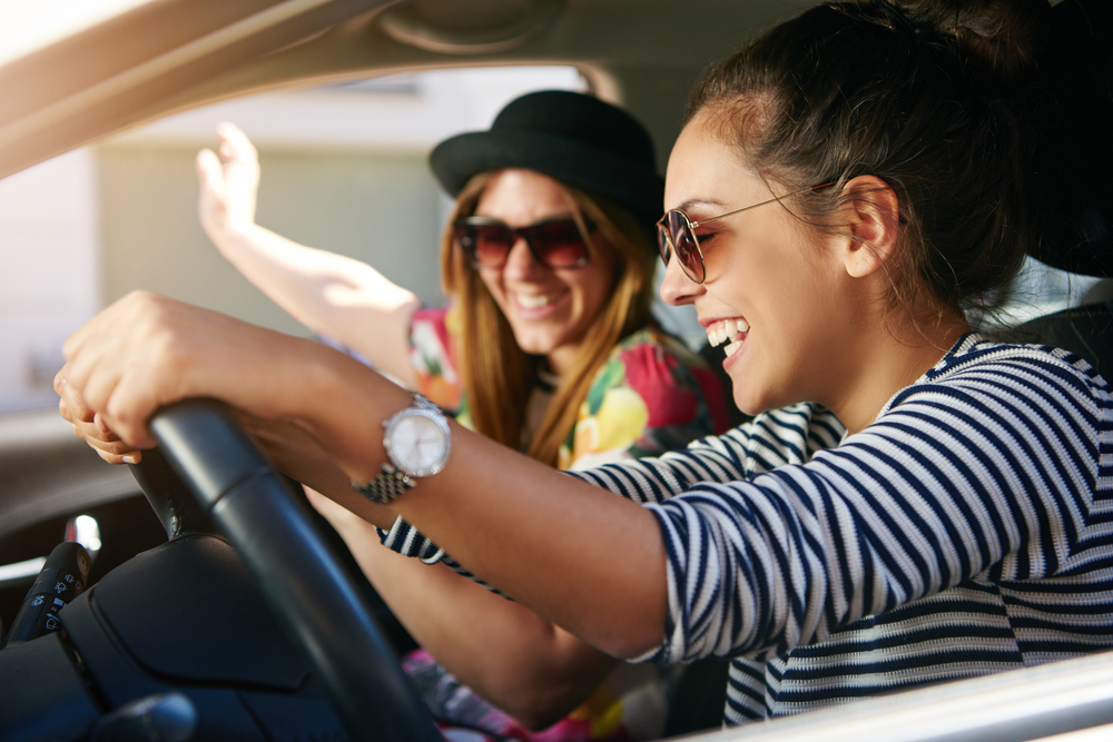 Young Ut students in a car together